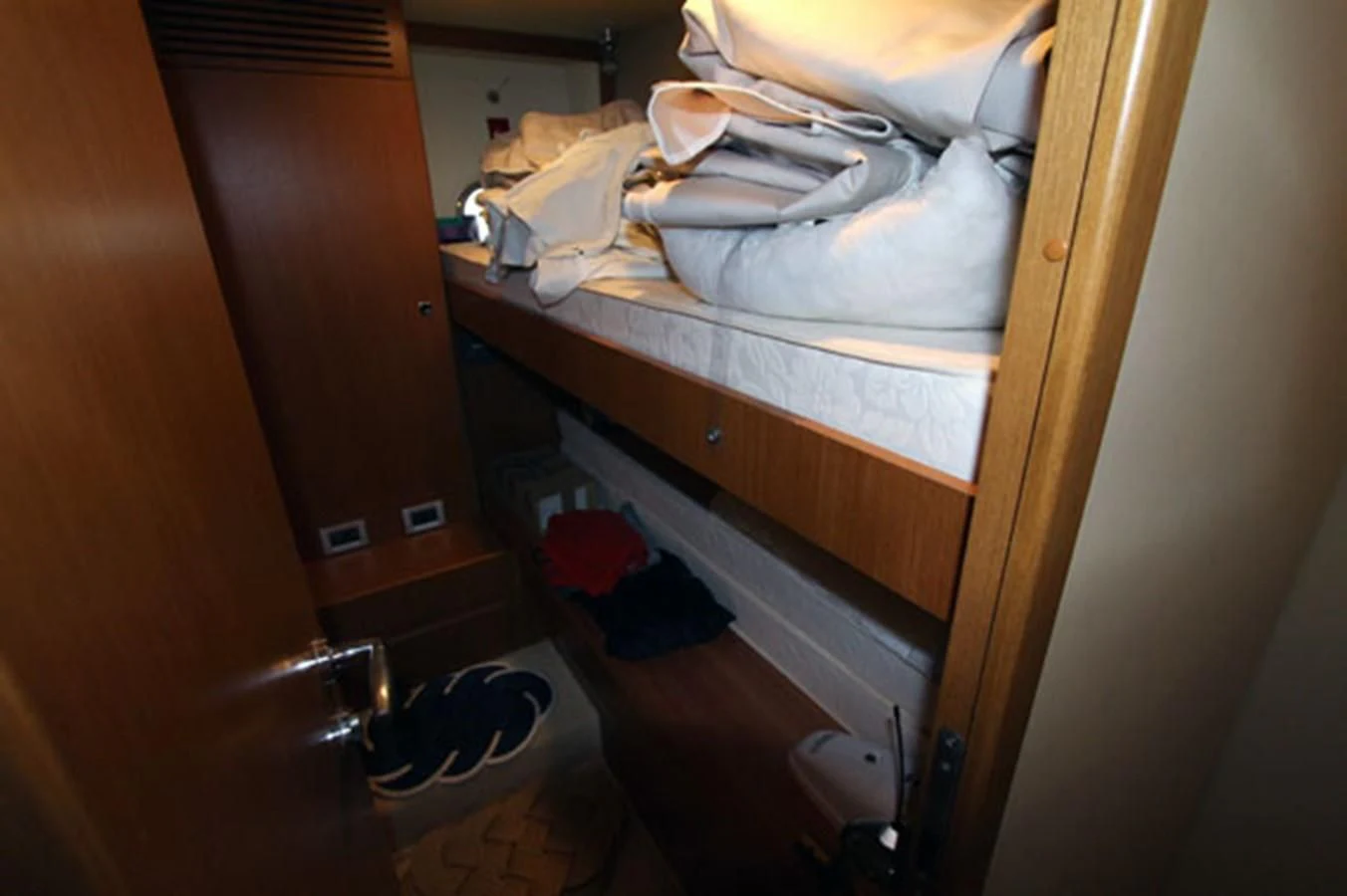 a closet with clothes on it aboard ARGO Yacht for Sale