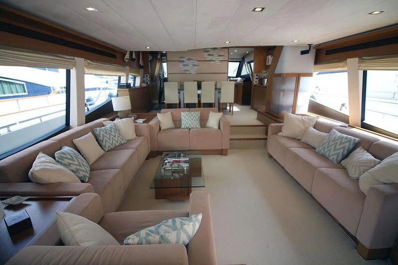 a living room with a couch and a coffee table aboard ARGO Yacht for Sale