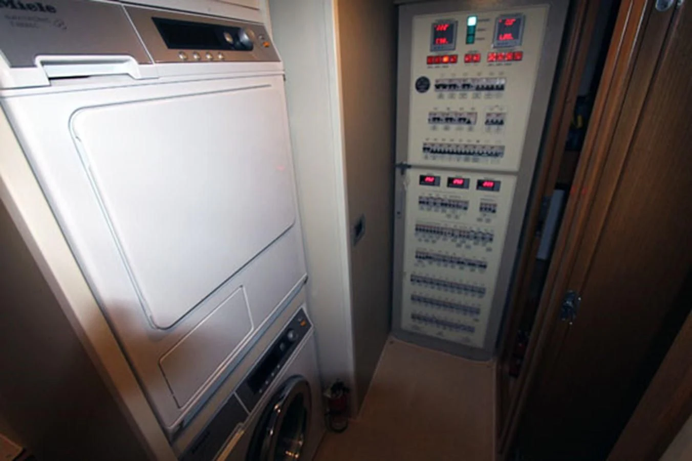 a fridge with a sign on the door aboard ARGO Yacht for Sale