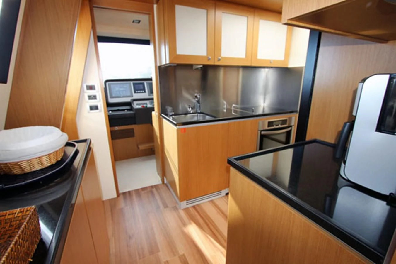 a kitchen with wooden floors aboard ARGO Yacht for Sale