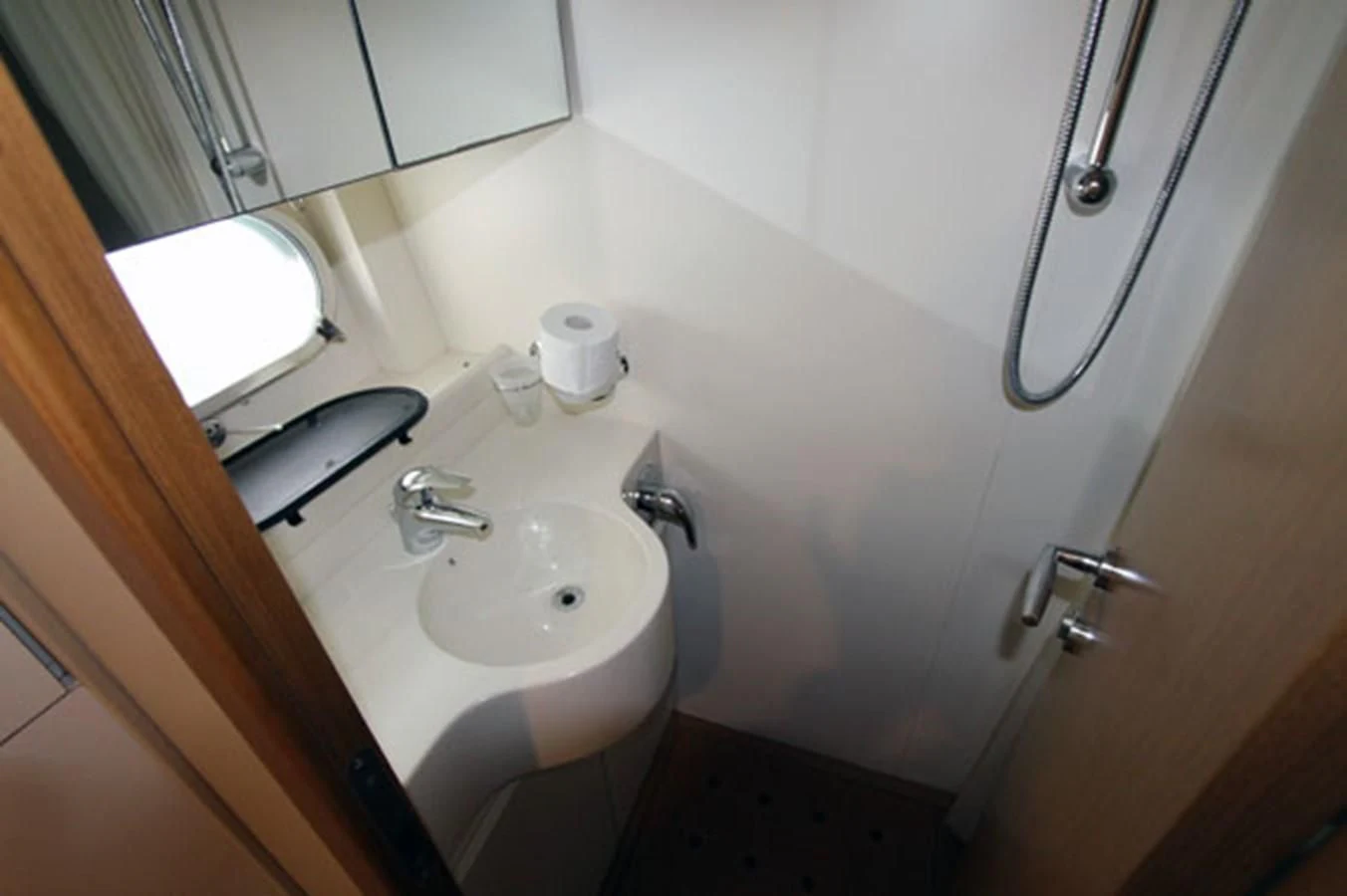 a bathroom with a sink and a mirror aboard ARGO Yacht for Sale
