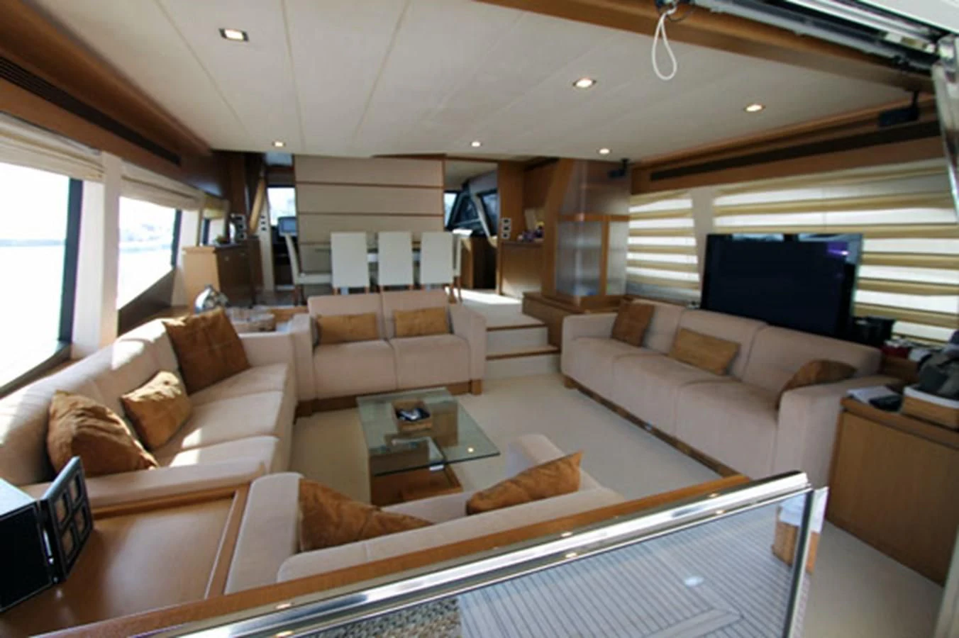 a living room with a couch and a coffee table aboard ARGO Yacht for Sale