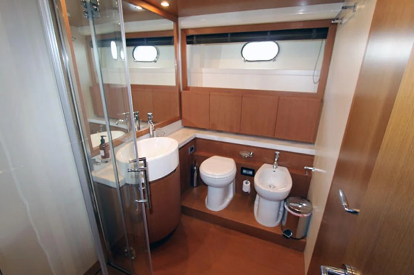 a bathroom with a glass shower aboard ARGO Yacht for Sale