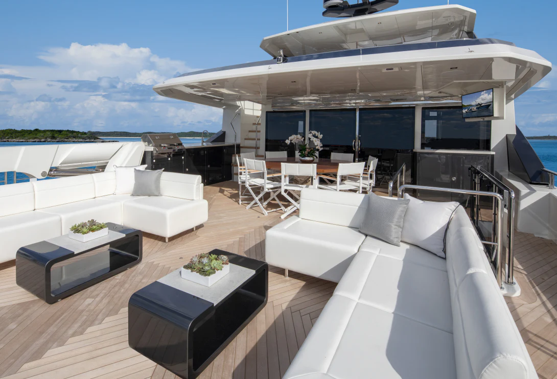 a room with a couch and a table and a large building aboard MÖBIUS Yacht for Sale