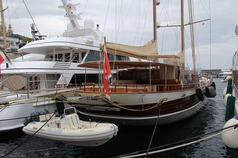 a large boat in a harbor aboard DON CHRIS Yacht for Sale
