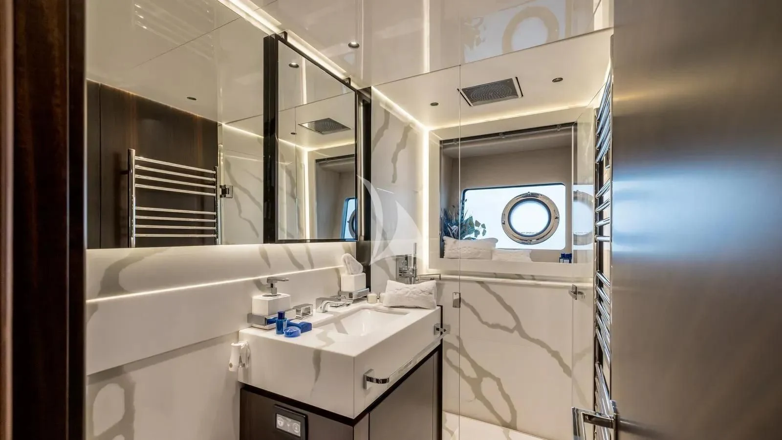 a bathroom with a sink and a mirror aboard EXIT Yacht for Sale