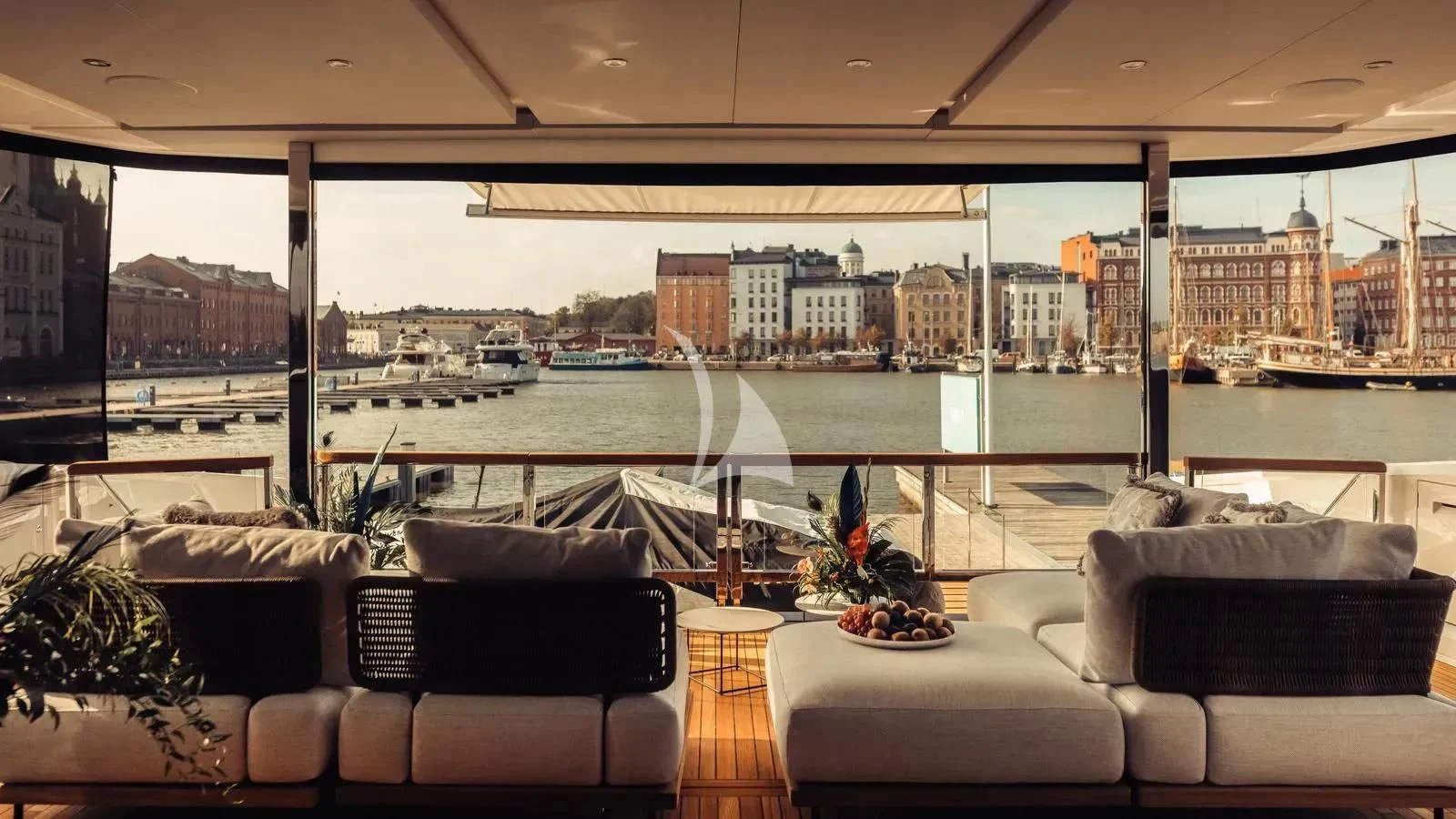 a room with couches and a view of a city aboard EXIT Yacht for Sale