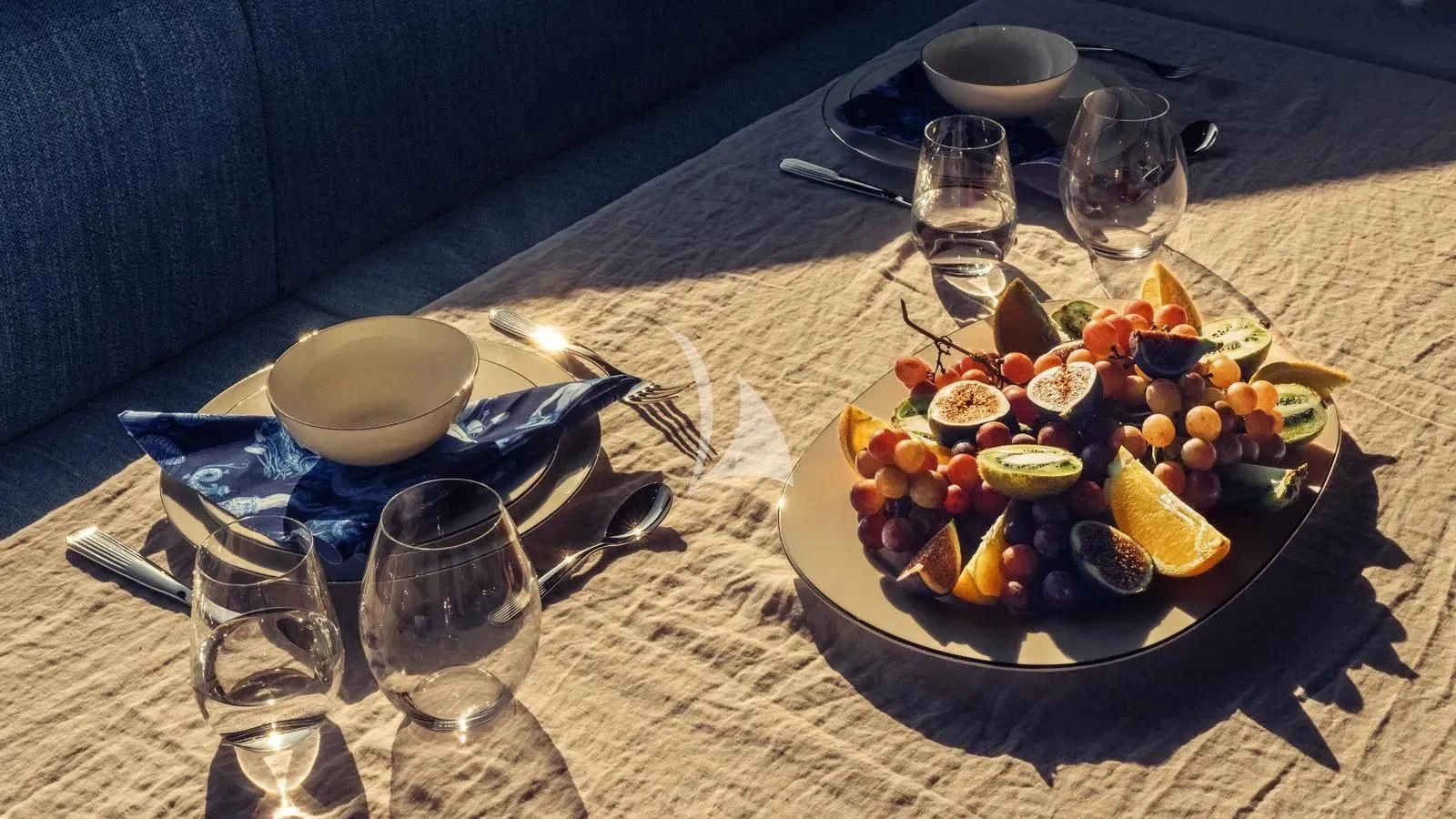 a plate of sushi and chopsticks on a table aboard EXIT Yacht for Sale