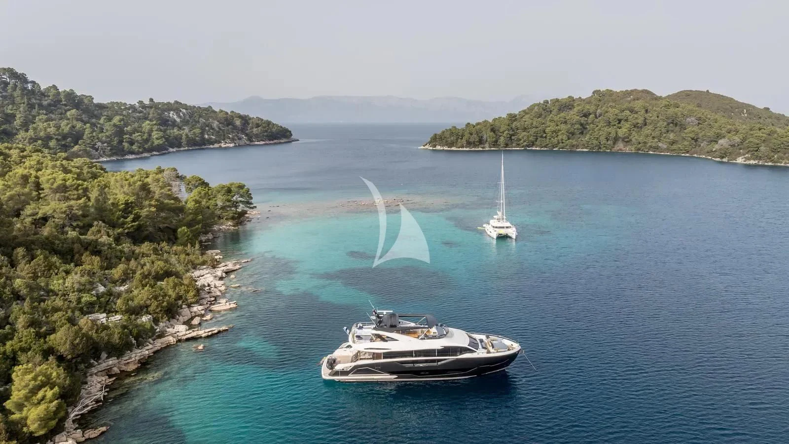 a boat sailing on the water aboard EXIT Yacht for Sale