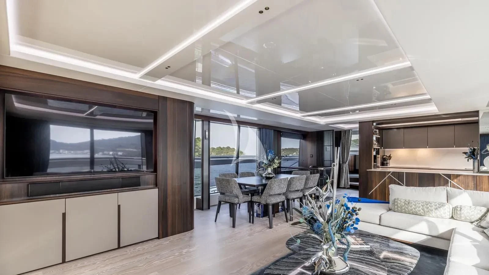 a room with a table and chairs aboard EXIT Yacht for Sale