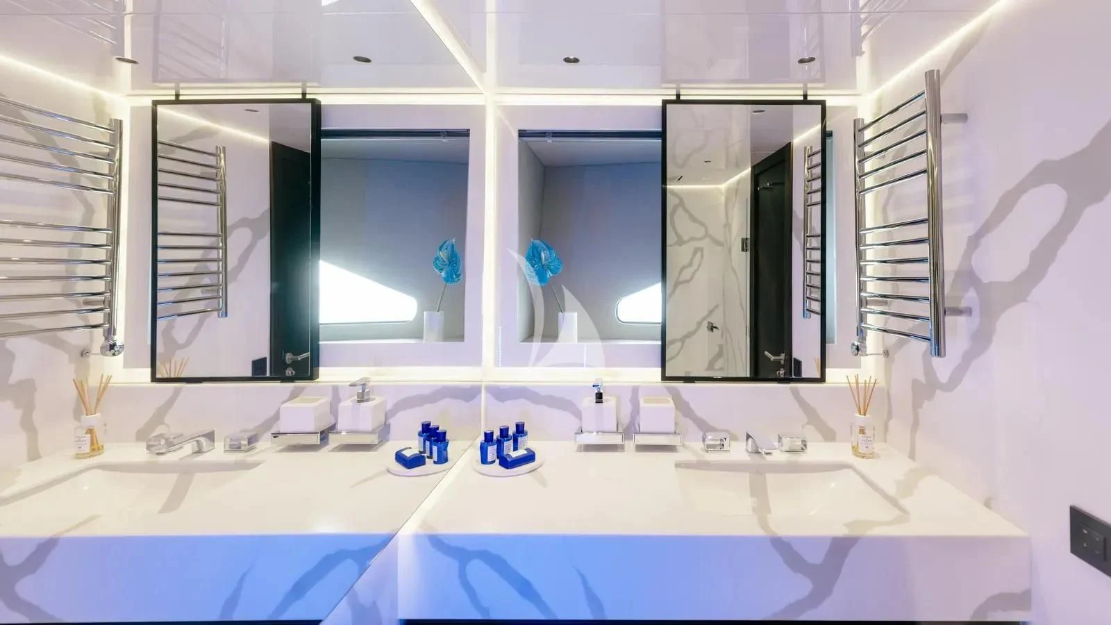 a bathroom with a large mirror aboard EXIT Yacht for Sale