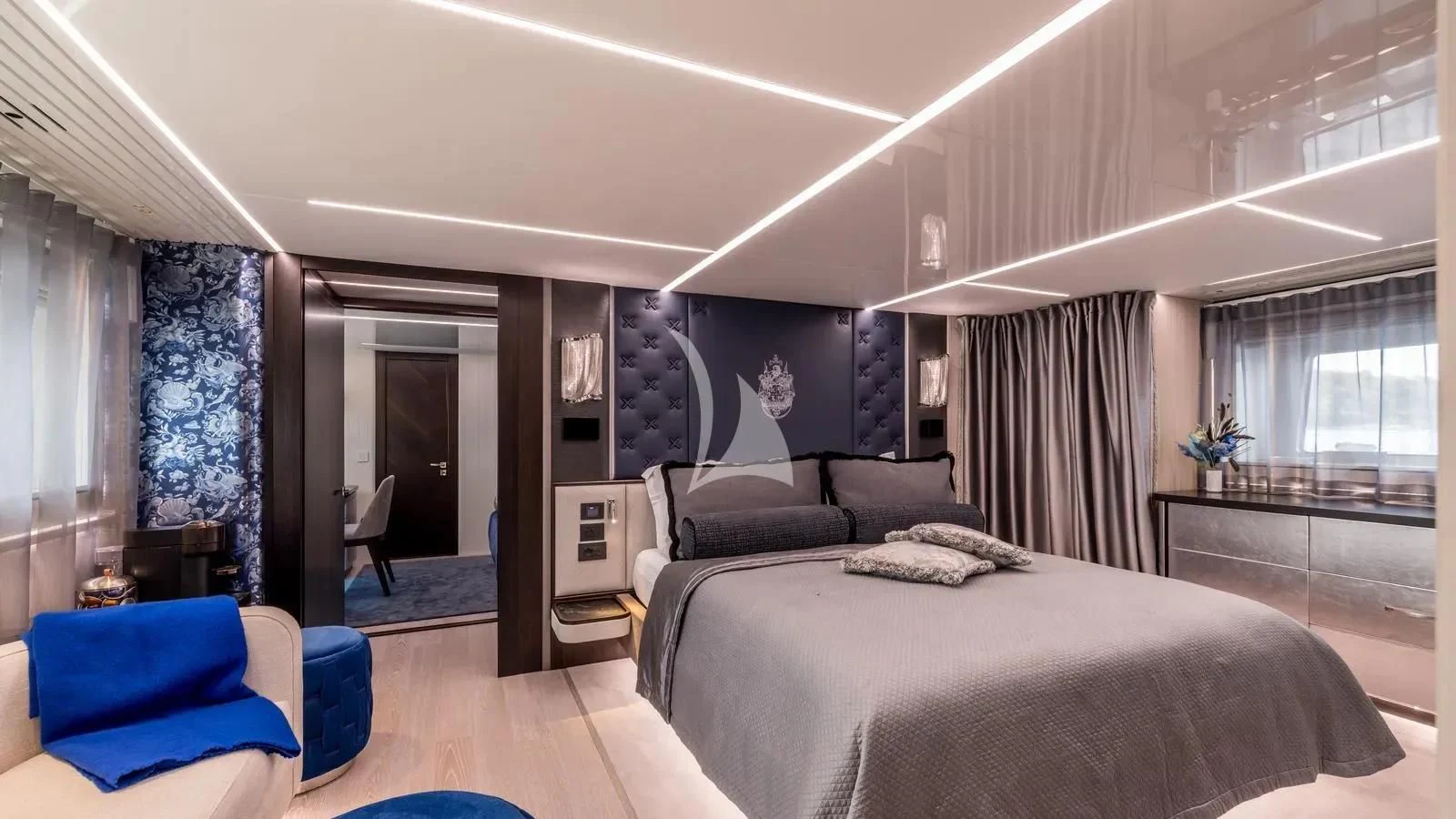 a bedroom with a bed and a couch aboard EXIT Yacht for Sale