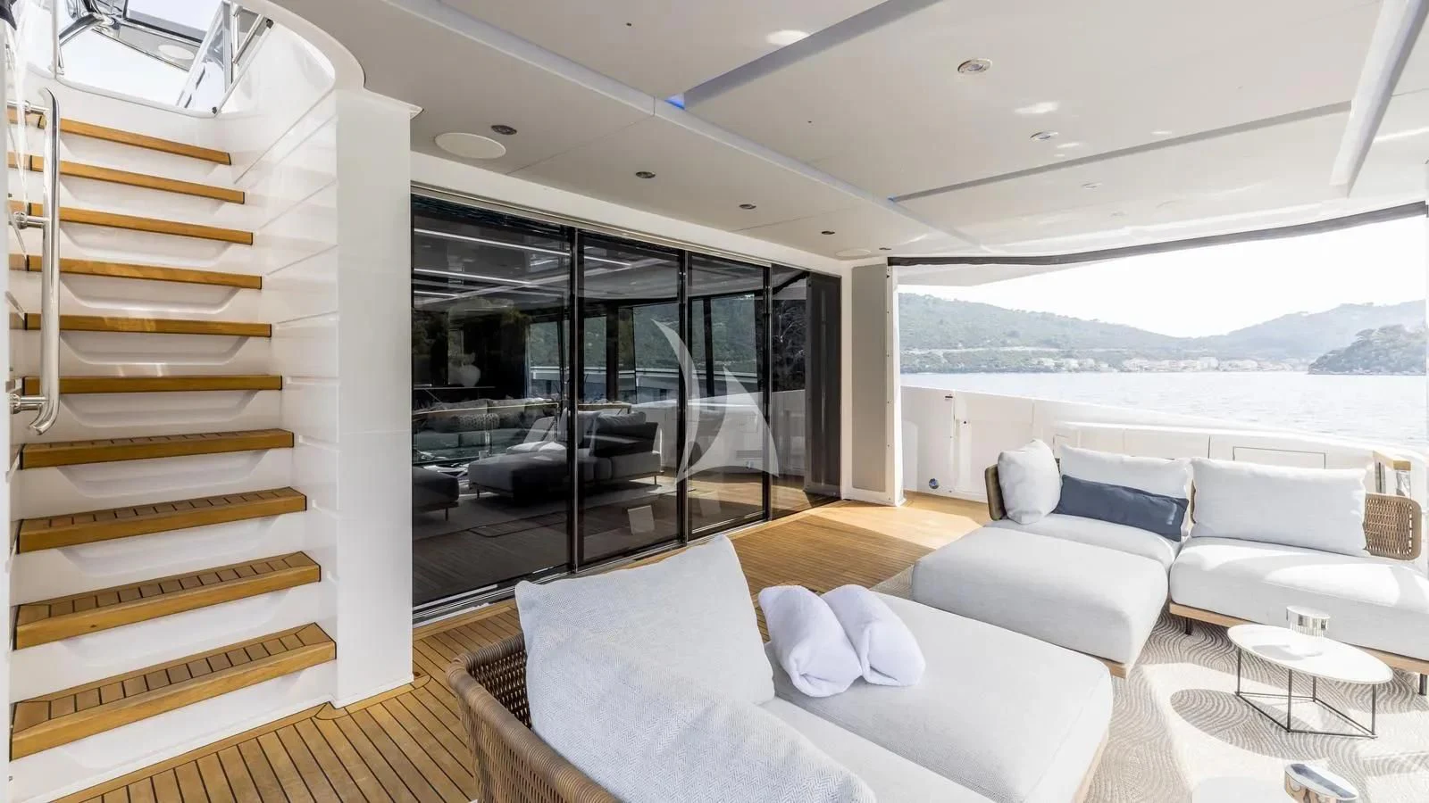 a room with a couch and a staircase aboard EXIT Yacht for Sale