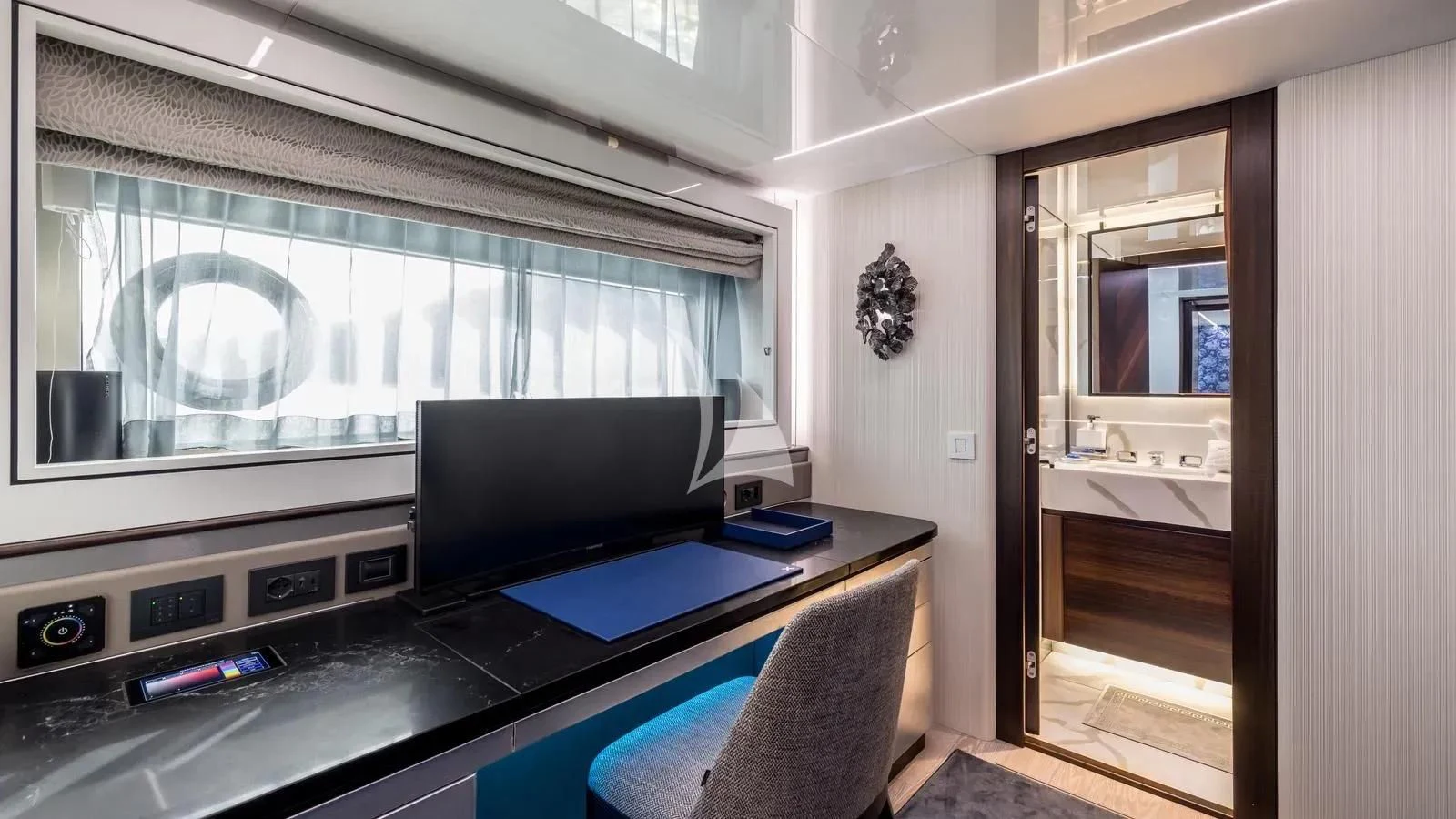a room with a desk and a tv aboard EXIT Yacht for Sale