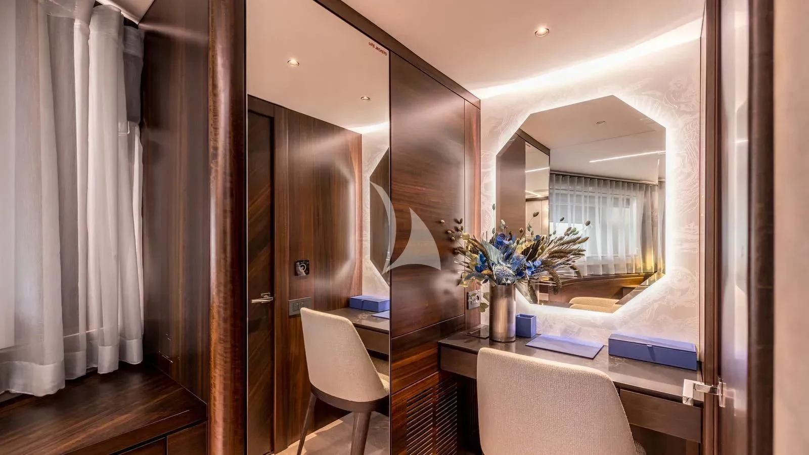 a room with a mirror and a bed aboard EXIT Yacht for Sale