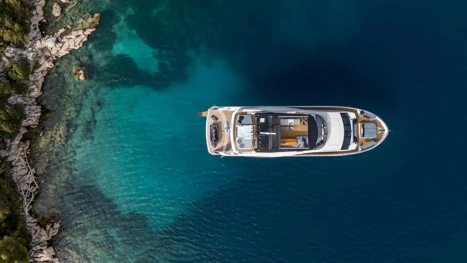 a car on the water aboard EXIT Yacht for Sale