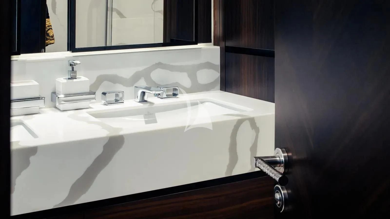 a bathroom sink with a mirror aboard EXIT Yacht for Sale