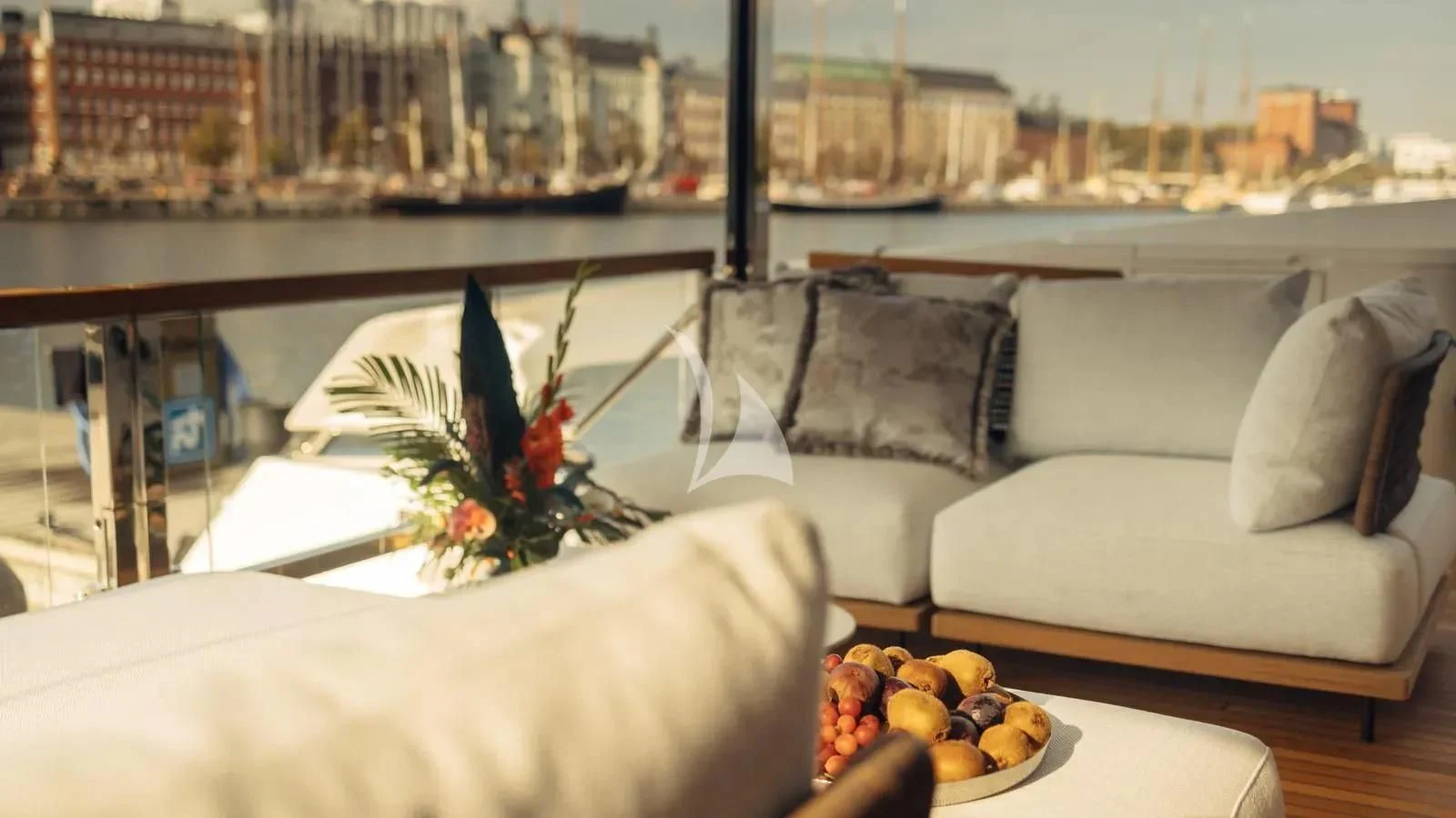 a room with couches and a table with food on it aboard EXIT Yacht for Sale
