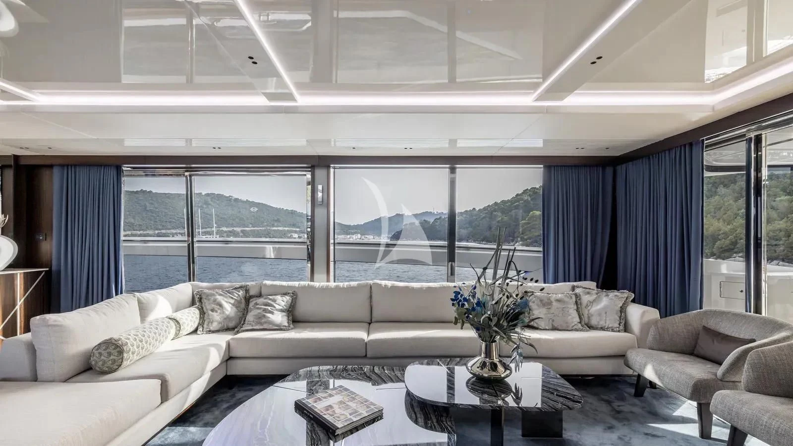 a living room with a large window aboard EXIT Yacht for Sale