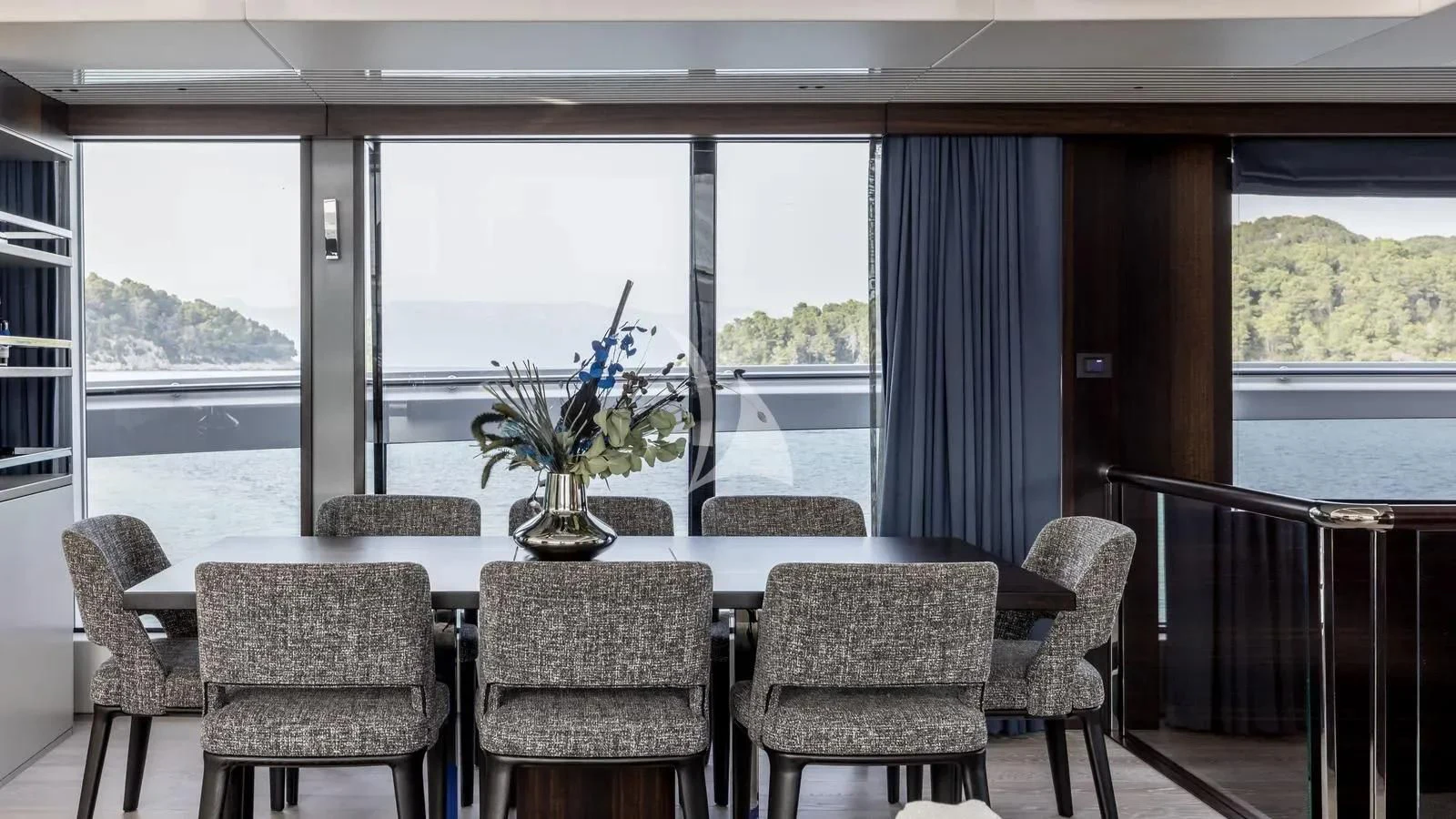 a room with a table and chairs aboard EXIT Yacht for Sale