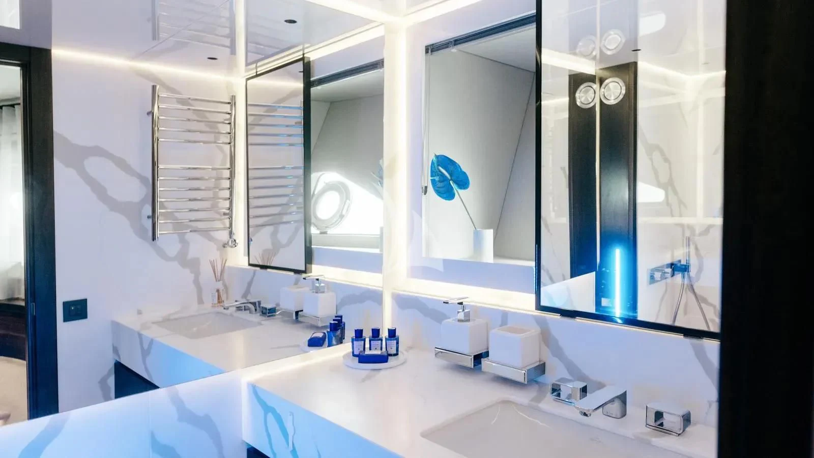a bathroom with a large mirror aboard EXIT Yacht for Sale