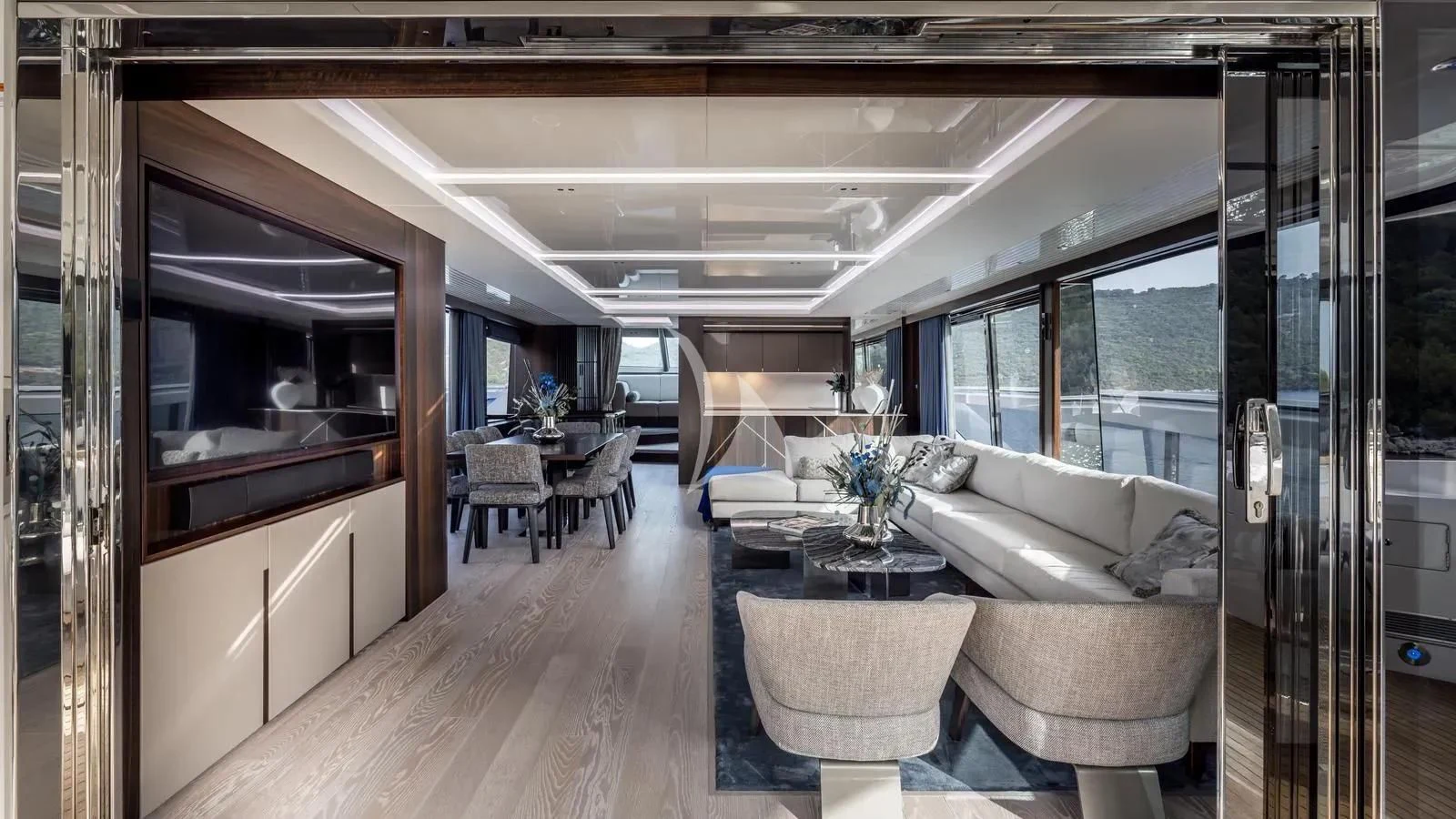 a living room with a large glass door aboard EXIT Yacht for Sale