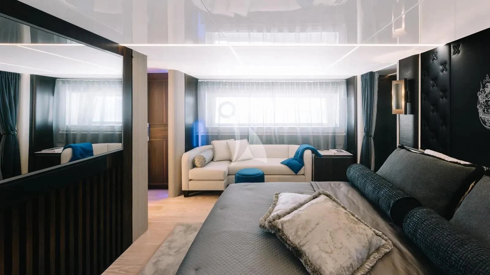 a room with a bed and a couch aboard EXIT Yacht for Sale