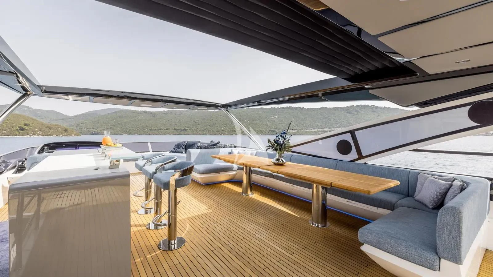 a room with a couch and a table and chairs aboard EXIT Yacht for Sale