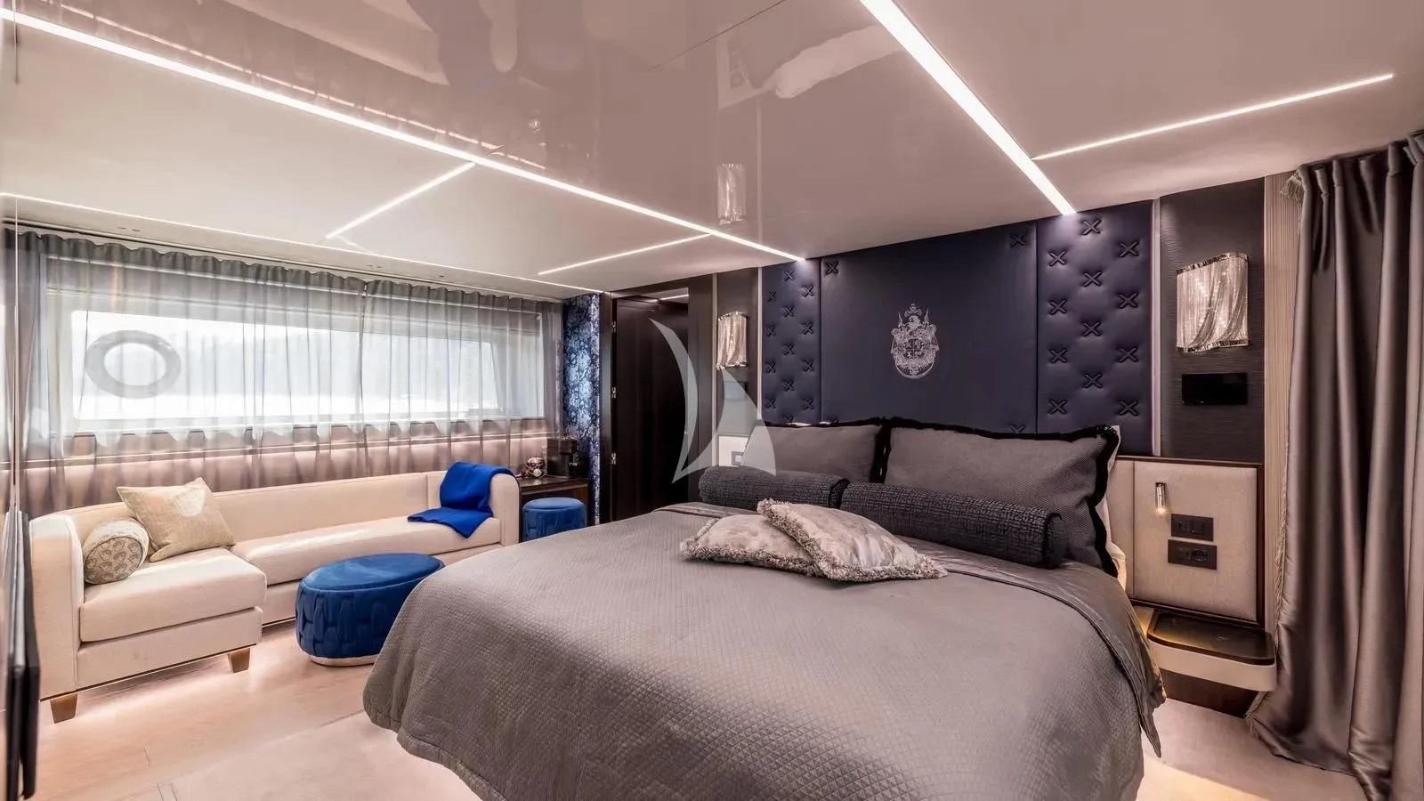 a room with a bed and a couch aboard EXIT Yacht for Sale
