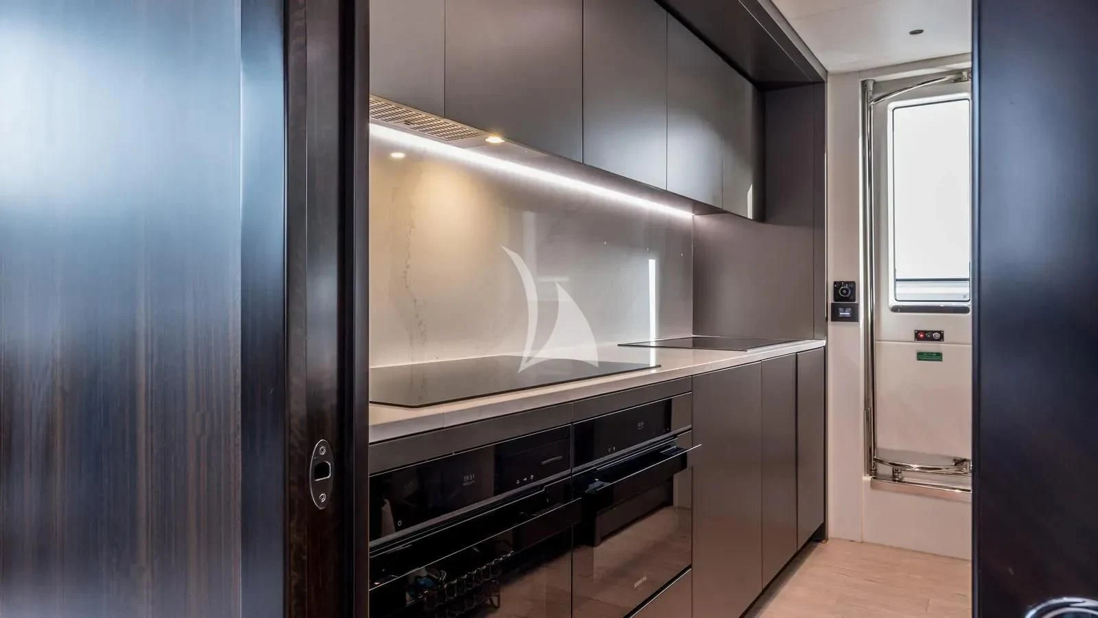 a kitchen with a large stainless steel oven aboard EXIT Yacht for Sale
