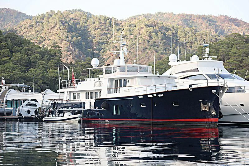 a boat docked at a pier aboard PAOLYRE Yacht for Sale