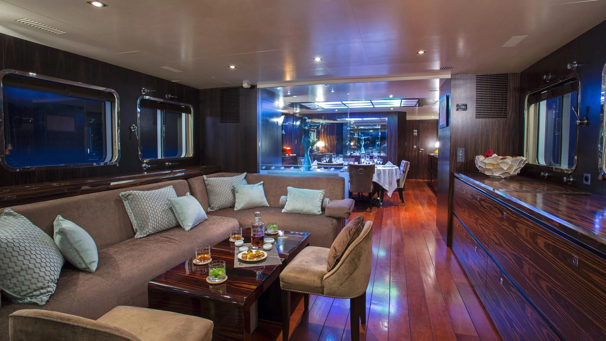 a living room with a large wood floor and a large television aboard PAOLYRE Yacht for Sale