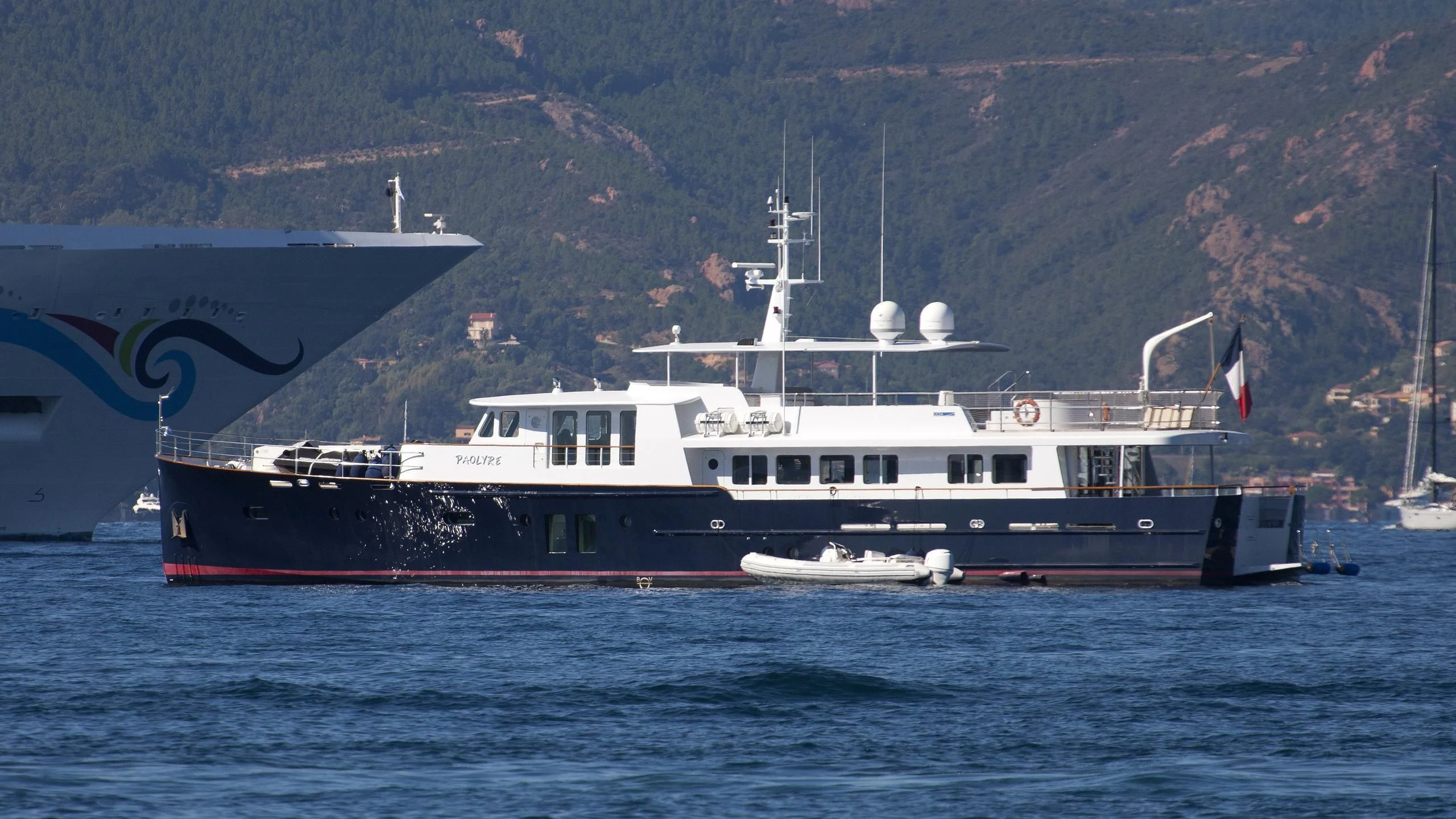 a large boat in the water aboard PAOLYRE Yacht for Sale