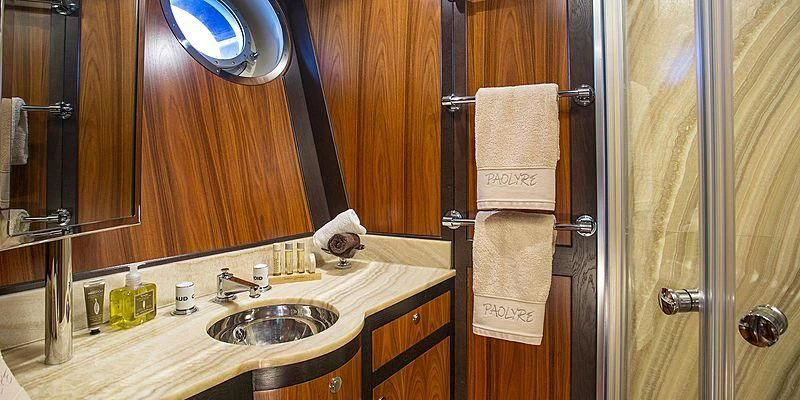 a bathroom with a sink and a mirror aboard PAOLYRE Yacht for Sale