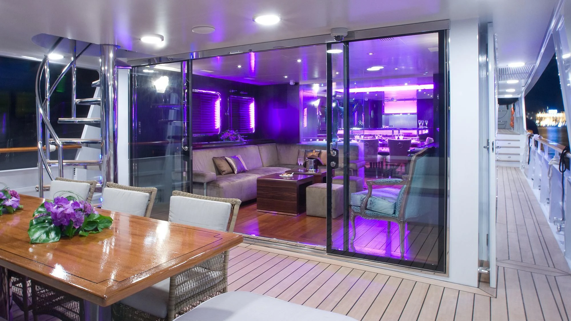 a room with a table and chairs aboard PAOLYRE Yacht for Sale