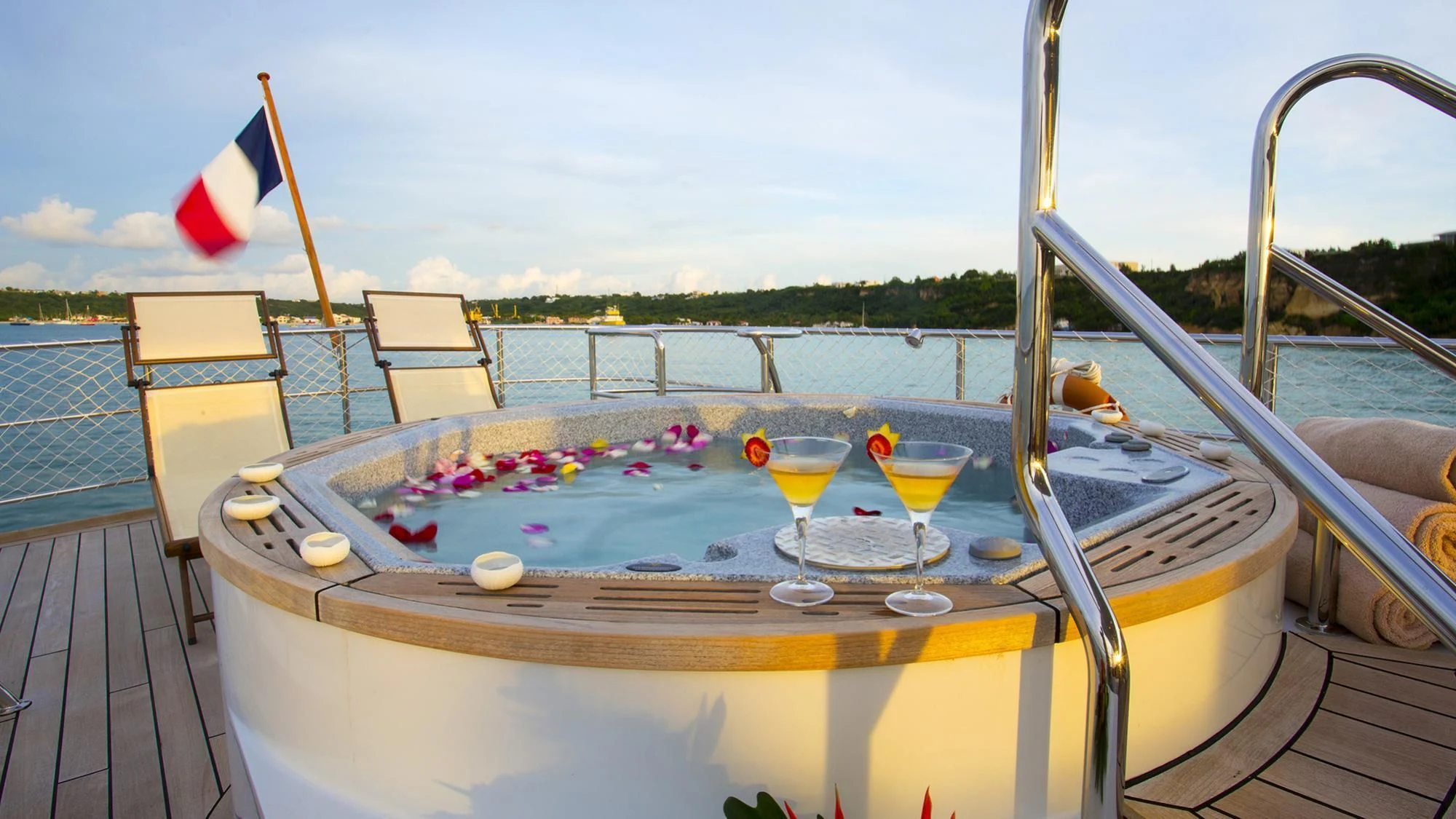 a table with food and drinks on it aboard PAOLYRE Yacht for Sale