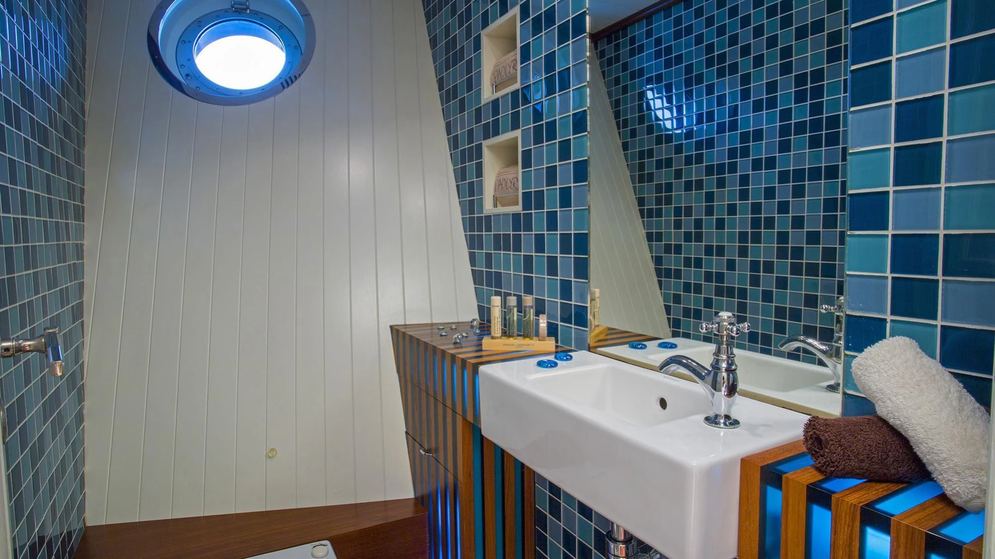 a bathroom with a sink and a mirror aboard PAOLYRE Yacht for Sale