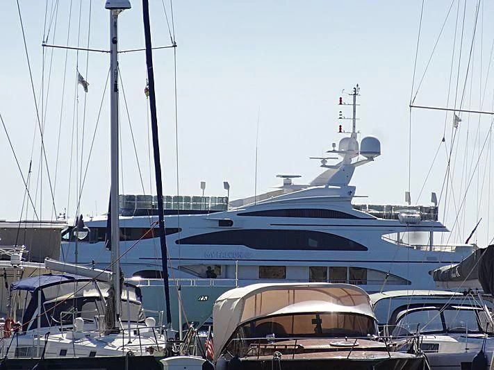 a large boat docked at a pier aboard MY FALCON Yacht for Sale