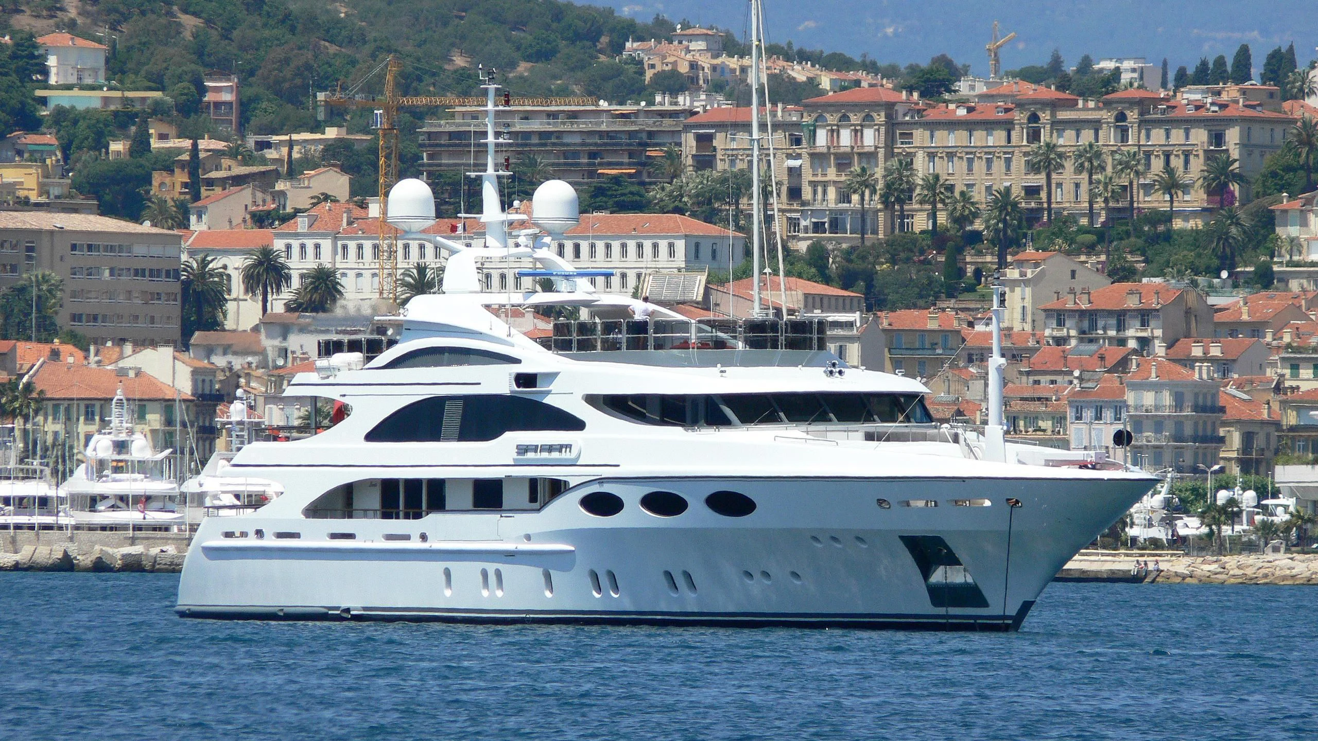 a white yacht in the water aboard MY FALCON Yacht for Sale