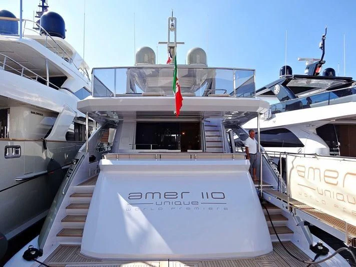 a boat with a flag on the front aboard MELT Yacht for Sale