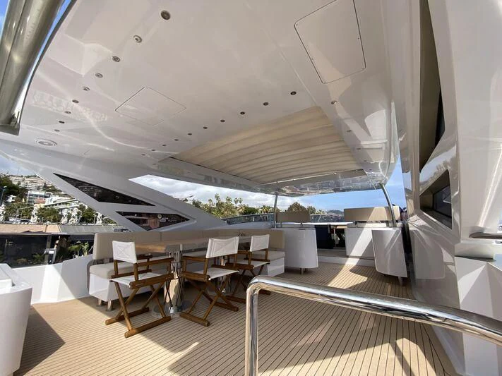 a room with tables and chairs aboard MELT Yacht for Sale