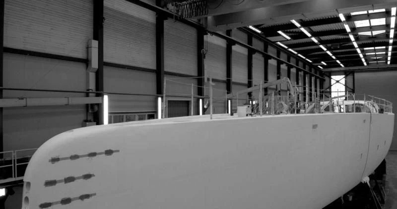 a large white boat in a warehouse aboard NGONI Yacht for Sale