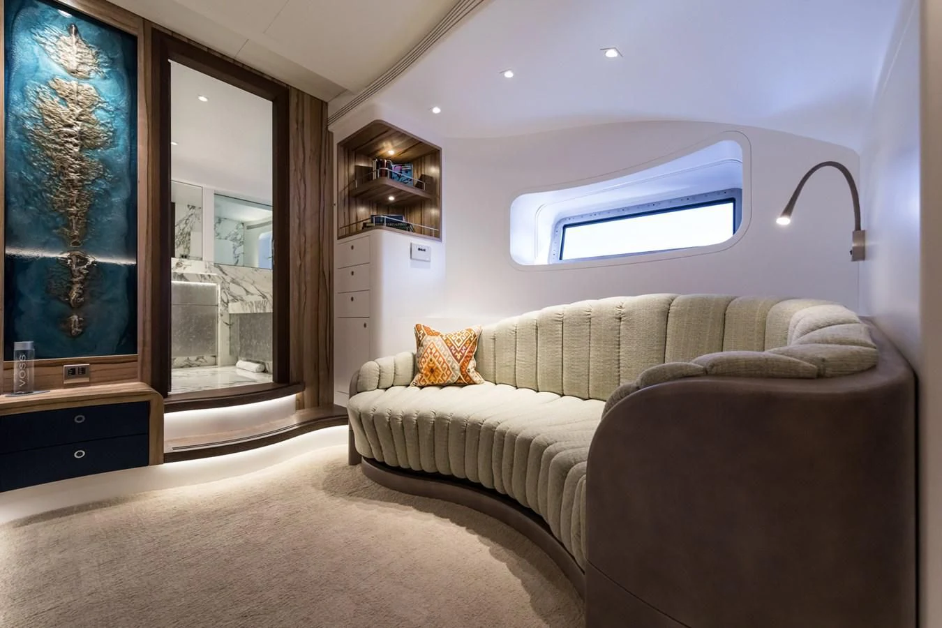 a bedroom with a bed and a window aboard NGONI Yacht for Sale