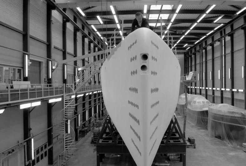 a white surfboard in a warehouse aboard NGONI Yacht for Sale