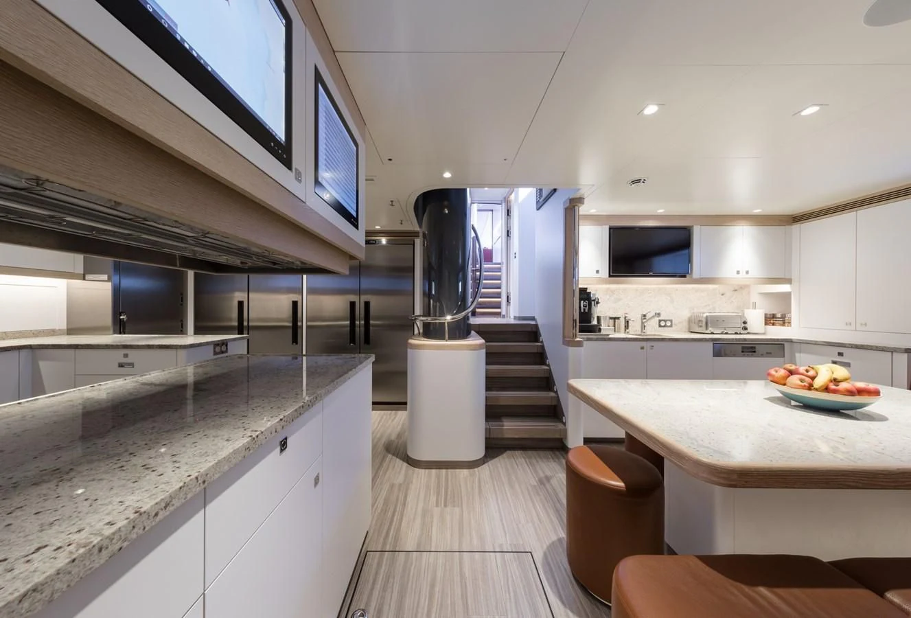 a kitchen with a large island aboard NGONI Yacht for Sale