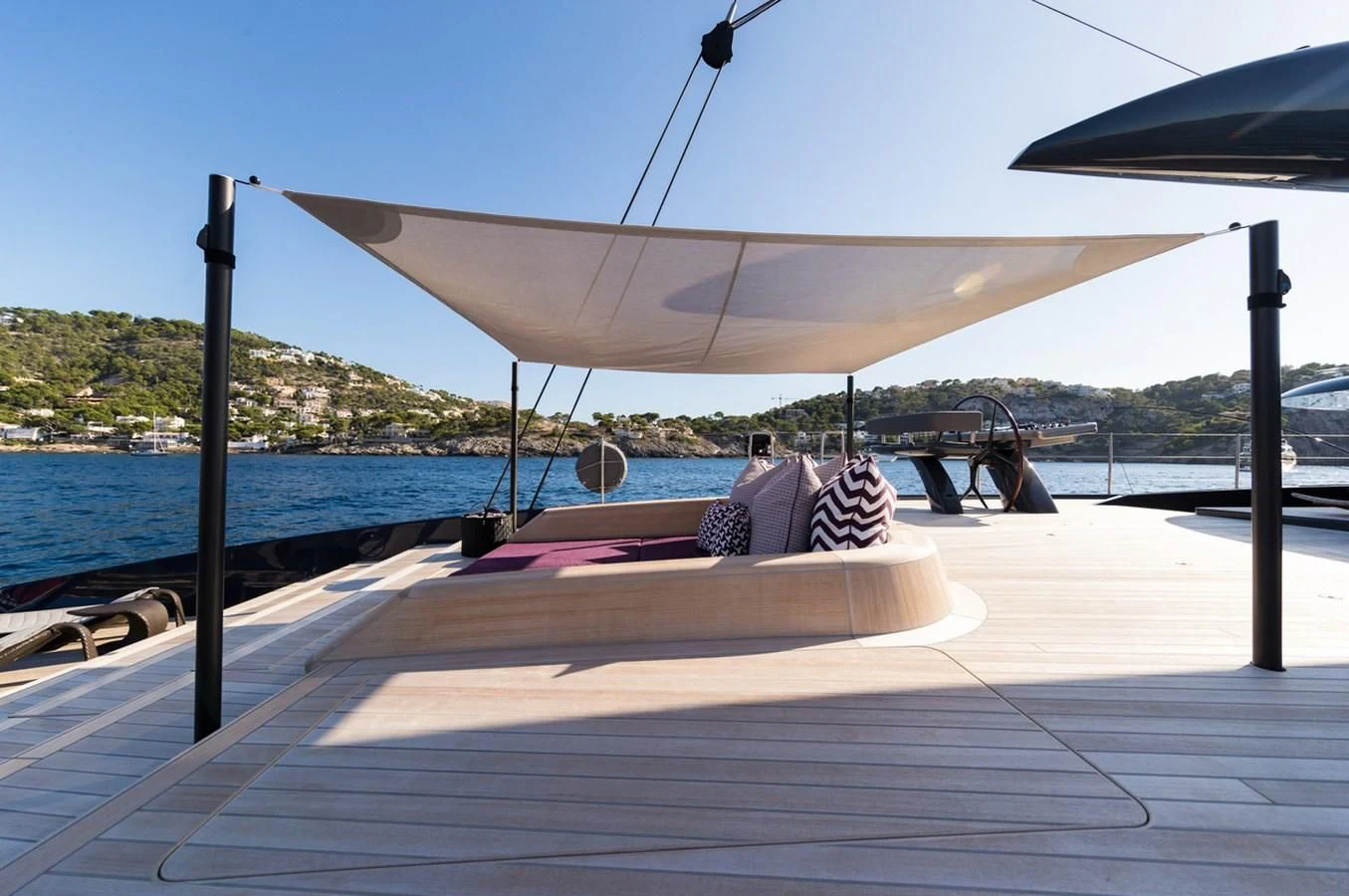 a person lying on a dock aboard NGONI Yacht for Sale
