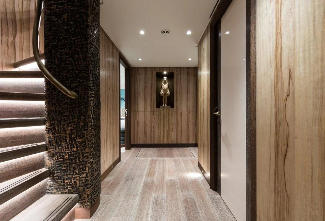 a hallway with wood walls aboard NGONI Yacht for Sale