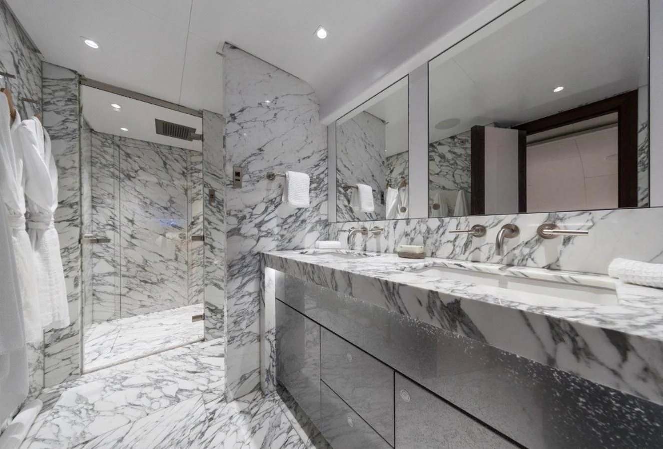 a bathroom with a large mirror aboard NGONI Yacht for Sale