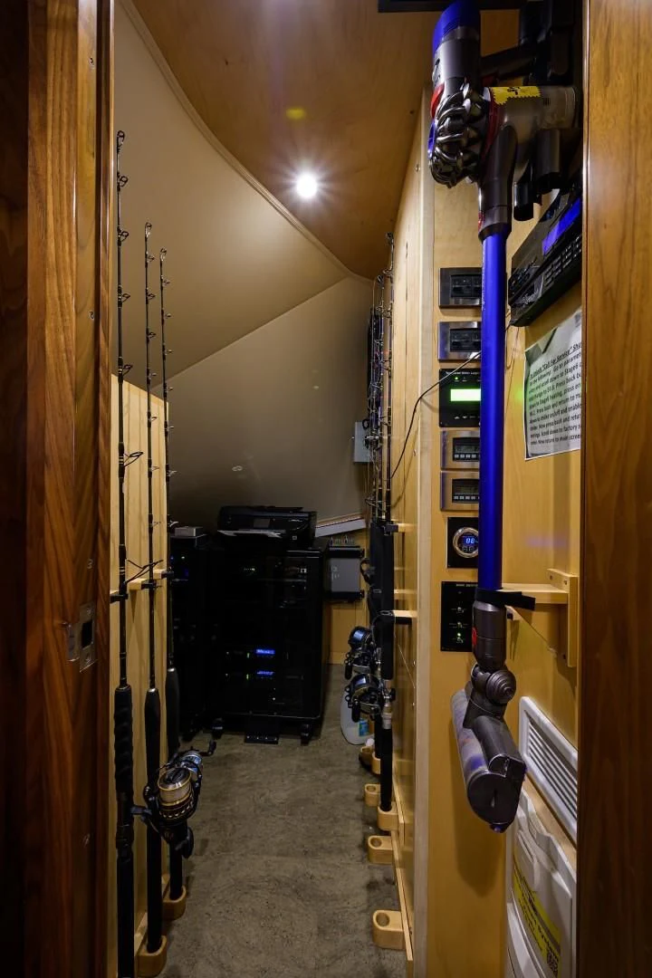 a room with a snowboard and a couple of skis aboard SWEETUMS Yacht for Sale