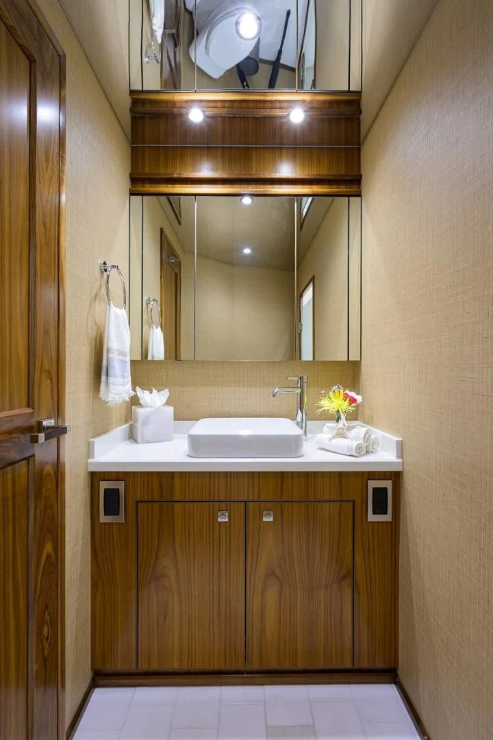 a bathroom with a sink and a mirror aboard SWEETUMS Yacht for Sale